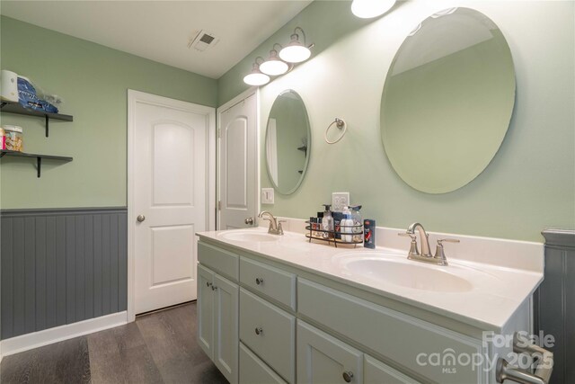 198 Anita Ln, Lexington, NC 27295 - full bath with wood finished floors, double vanity, and wainscoting