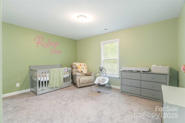 198 Anita Ln, Lexington, NC 27295 - carpeted bedroom with a nursery area and baseboards
