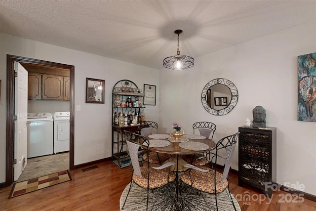 4920 Surfwood Dr, Sherrills Ford, NC 28673 - dining area featuring washer and dryer, wood finished floors, and baseboards