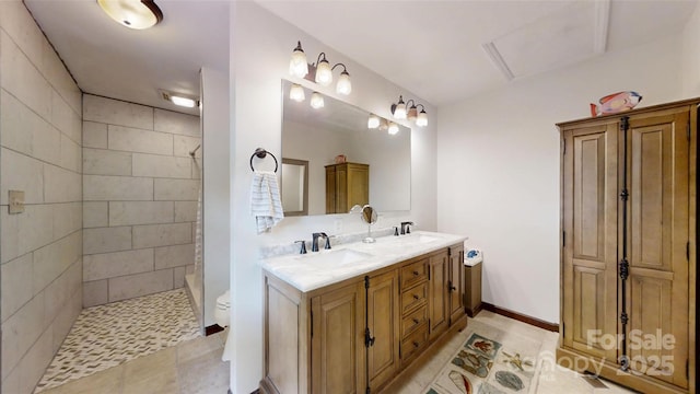 4920 Surfwood Dr, Sherrills Ford, NC 28673 - bathroom featuring double vanity, a tile shower, toilet, and tile patterned flooring