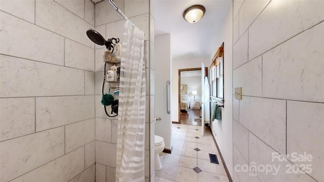 4920 Surfwood Dr, Sherrills Ford, NC 28673 - full bathroom with a tile shower, toilet, tile patterned floors, and ensuite bathroom