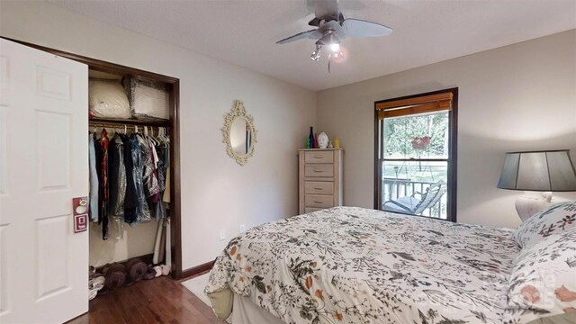 4920 Surfwood Dr, Sherrills Ford, NC 28673 - bedroom with a closet, dark wood finished floors, baseboards, and a ceiling fan
