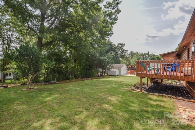 4920 Surfwood Dr, Sherrills Ford, NC 28673 - view of green lawn with a wooden deck and an outbuilding
