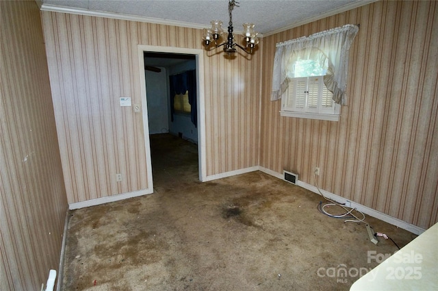 402 Villa St, Kannapolis, NC 28083 - unfurnished dining area with a chandelier, wallpapered walls, ornamental molding, baseboards, and carpet floors