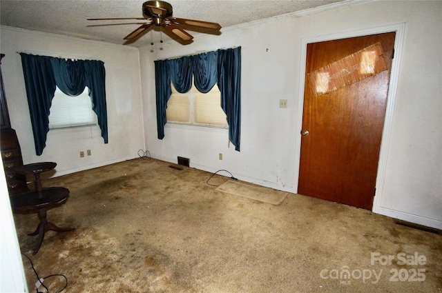 402 Villa St, Kannapolis, NC 28083 - unfurnished room with a ceiling fan, crown molding, and a textured ceiling