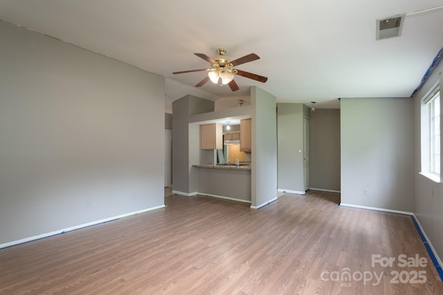 8019 Walnut Creek Ln, Charlotte, NC 28227 - unfurnished living room featuring a ceiling fan, vaulted ceiling, and wood finished floors