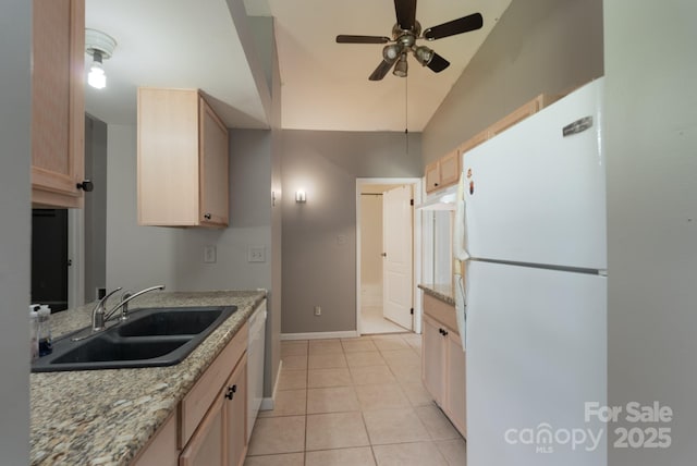 8019 Walnut Creek Ln, Charlotte, NC 28227 - kitchen with white appliances, light brown cabinetry, ceiling fan, light tile patterned flooring, and lofted ceiling