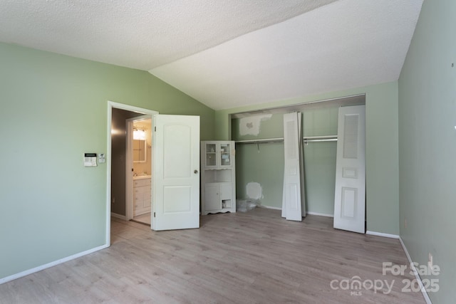 8019 Walnut Creek Ln, Charlotte, NC 28227 - unfurnished bedroom with wood finished floors, lofted ceiling, and a closet