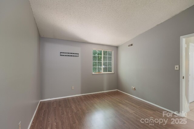 8019 Walnut Creek Ln, Charlotte, NC 28227 - unfurnished room with wood finished floors and a textured ceiling