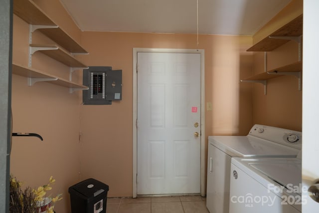 8019 Walnut Creek Ln, Charlotte, NC 28227 - laundry room with washing machine and clothes dryer, electric panel, and light tile patterned flooring