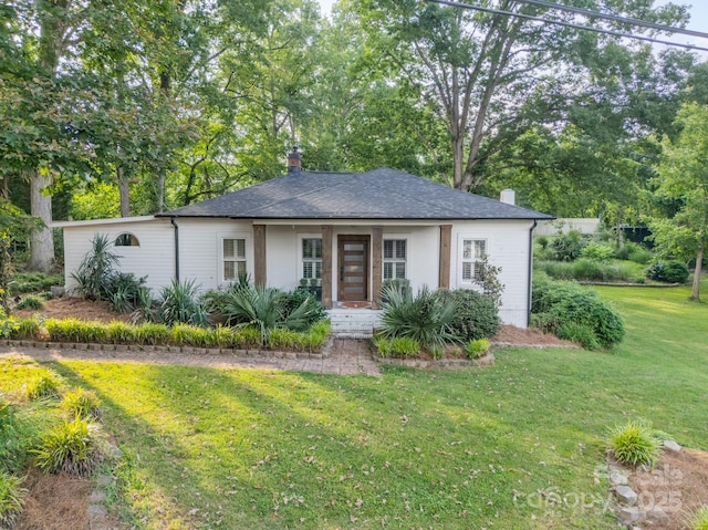 7901 Bud Henderson Rd, Huntersville, NC 28078 - view of front of home with a front yard, a chimney, and a shingled roof