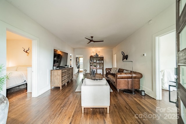 7901 Bud Henderson Rd, Huntersville, NC 28078 - living area with dark wood-type flooring and ceiling fan