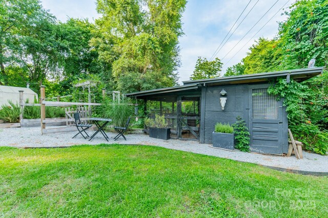 7901 Bud Henderson Rd, Huntersville, NC 28078 - view of grassy yard featuring an outbuilding