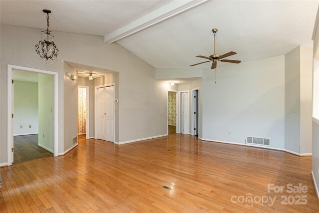 93 Wood Duck Ct, Brevard, NC 28712 - unfurnished room with a ceiling fan, light wood-style flooring, and a chandelier