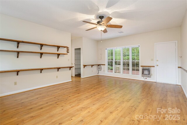 93 Wood Duck Ct, Brevard, NC 28712 - unfurnished living room with heating unit, light wood-style floors, and a ceiling fan