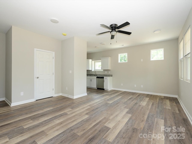 614 Kings Mountain St, Clover, SC 29710 - unfurnished living room featuring light wood-type flooring and a ceiling fan