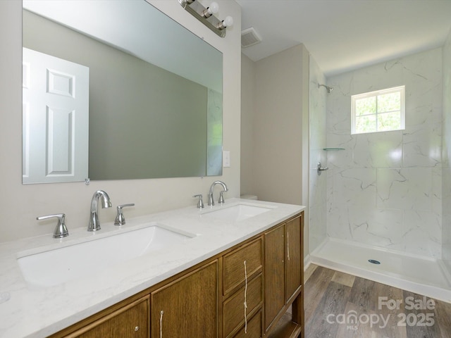 614 Kings Mountain St, Clover, SC 29710 - full bath with double vanity, a marble finish shower, and wood finished floors