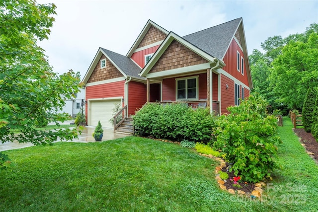 253 Flat Creek Rd, Black Mountain, NC 28711 - craftsman-style home with a porch, an attached garage, a front lawn, and roof with shingles