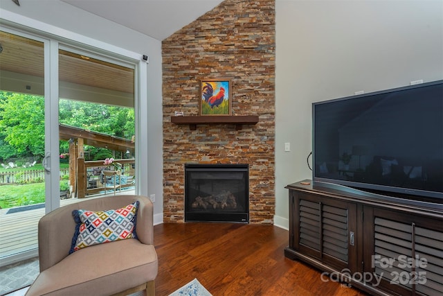 253 Flat Creek Rd, Black Mountain, NC 28711 - living room featuring plenty of natural light, wood finished floors, a stone fireplace, and high vaulted ceiling