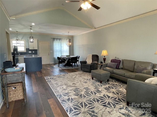 210 Rhyne St, Stanley, NC 28164 - living room featuring a ceiling fan, dark wood-style floors, vaulted ceiling, and ornamental molding