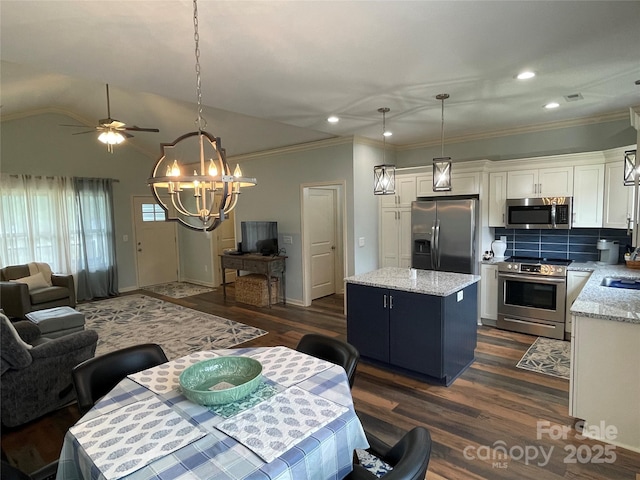 210 Rhyne St, Stanley, NC 28164 - dining space with a chandelier, dark wood finished floors, ornamental molding, recessed lighting, and ceiling fan