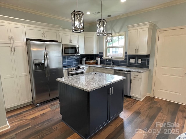 210 Rhyne St, Stanley, NC 28164 - kitchen featuring stainless steel appliances, a sink, crown molding, recessed lighting, and white cabinetry