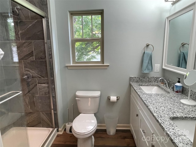 210 Rhyne St, Stanley, NC 28164 - bathroom featuring toilet, double vanity, a stall shower, and wood finished floors