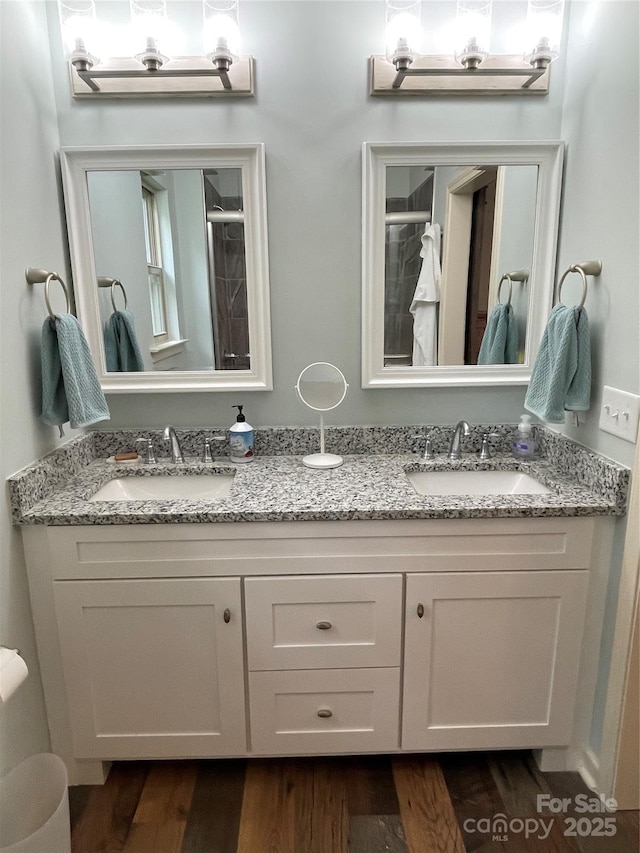 210 Rhyne St, Stanley, NC 28164 - full bath featuring double vanity, wood finished floors, and a shower