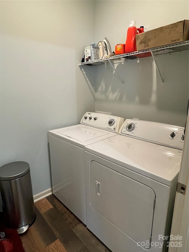 210 Rhyne St, Stanley, NC 28164 - laundry area featuring separate washer and dryer, dark wood finished floors, and baseboards