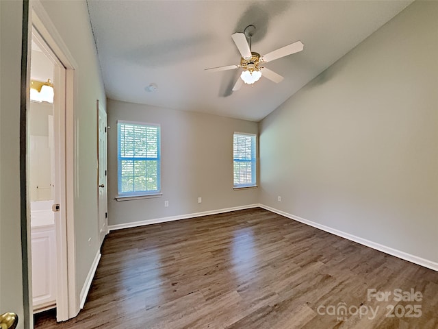 4328 Frank Vance Rd, Charlotte, NC 28216 - unfurnished room with lofted ceiling, dark wood-style flooring, baseboards, and a ceiling fan
