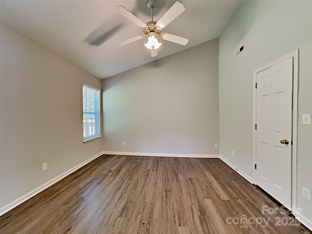 4328 Frank Vance Rd, Charlotte, NC 28216 - spare room featuring lofted ceiling, wood finished floors, ceiling fan, and baseboards