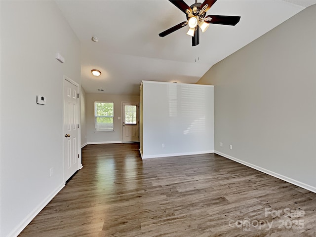 4328 Frank Vance Rd, Charlotte, NC 28216 - empty room featuring vaulted ceiling, a ceiling fan, wood finished floors, baseboards, and a smoke detector