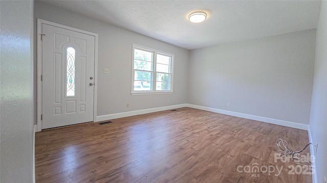 1838 Harmon St, Morganton, NC 28655 - foyer entrance with wood finished floors and baseboards