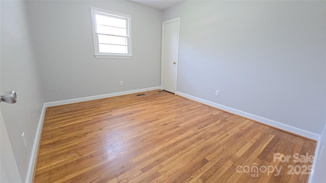 1838 Harmon St, Morganton, NC 28655 - empty room with light wood-style flooring and baseboards