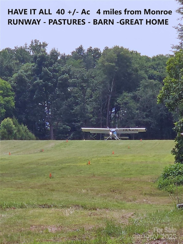 2905 Medlin Rd, Monroe, NC 28112 - view of green lawn with a view of trees