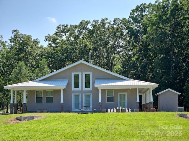 2905 Medlin Rd, Monroe, NC 28112 - tri-level home featuring a front yard, stucco siding, and a metal roof
