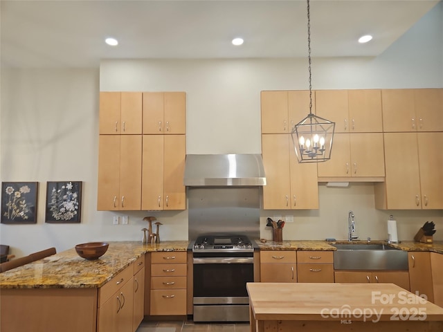 2905 Medlin Rd, Monroe, NC 28112 - kitchen featuring wall chimney exhaust hood, stainless steel gas stove, a peninsula, pendant lighting, and light stone counters