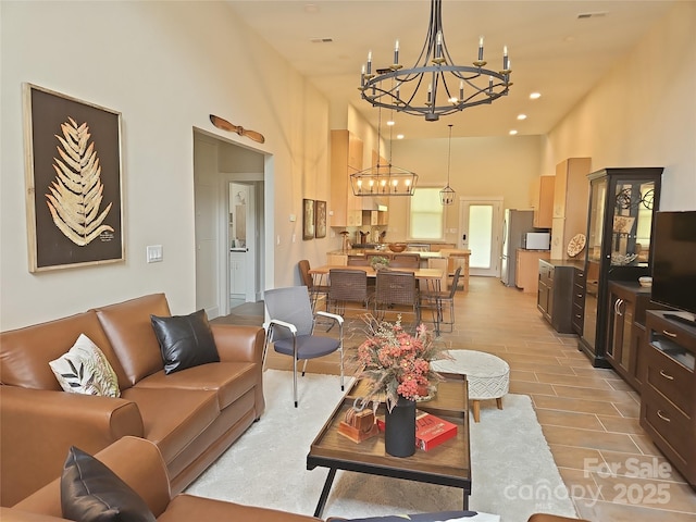 2905 Medlin Rd, Monroe, NC 28112 - living area featuring a chandelier, a towering ceiling, and recessed lighting