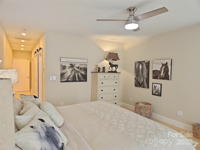 2905 Medlin Rd, Monroe, NC 28112 - bedroom with a barn door, baseboards, recessed lighting, and a ceiling fan