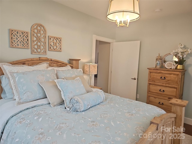 2905 Medlin Rd, Monroe, NC 28112 - bedroom featuring a chandelier
