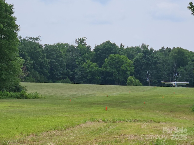 2905 Medlin Rd, Monroe, NC 28112 - view of grassy yard featuring a forest view