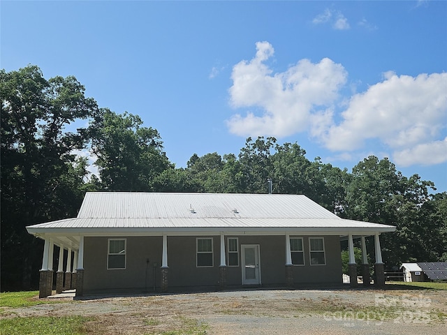 2905 Medlin Rd, Monroe, NC 28112 - farmhouse inspired home featuring covered porch, a metal roof, and stucco siding