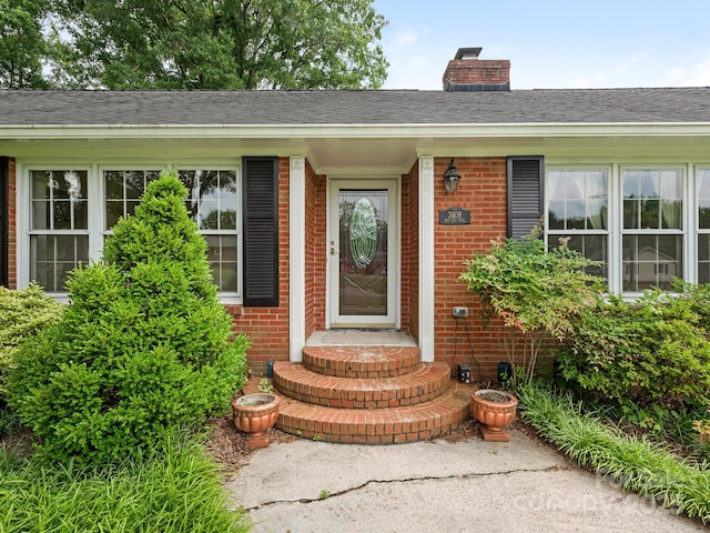 3408 Oak Tree Trl, Matthews, NC 28105 - doorway to property with a chimney and brick siding