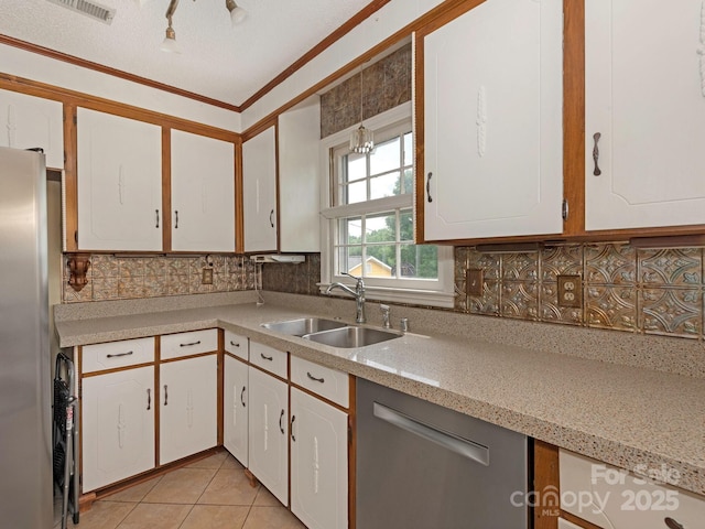 3408 Oak Tree Trl, Matthews, NC 28105 - kitchen with a sink, light countertops, crown molding, appliances with stainless steel finishes, and white cabinetry