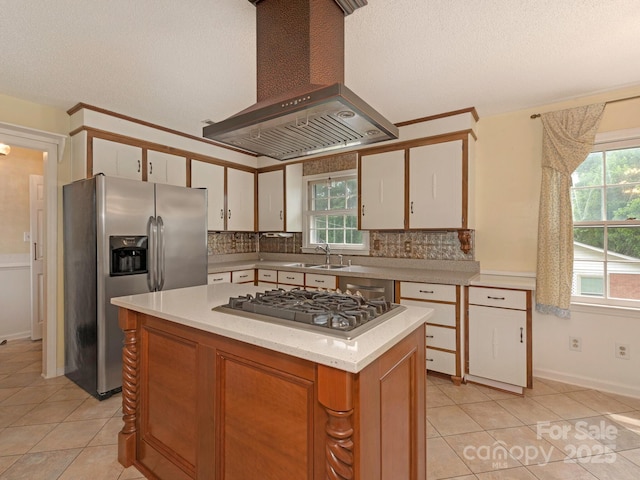 3408 Oak Tree Trl, Matthews, NC 28105 - kitchen with stainless steel appliances, wall chimney exhaust hood, light tile patterned floors, light countertops, and a sink