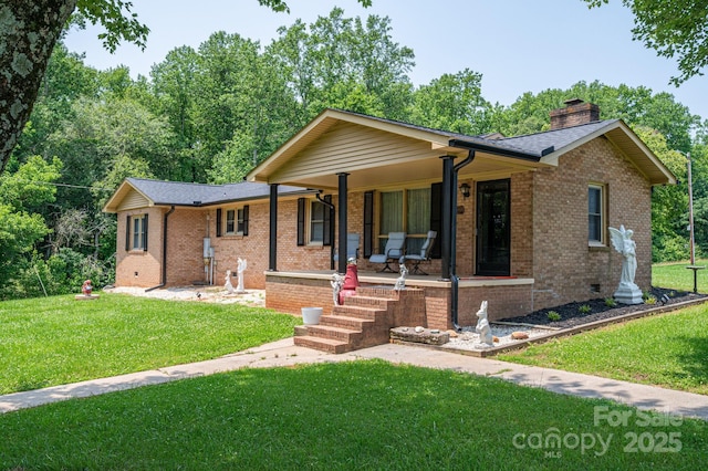 5958 Hoover Elmore Rd, Lincolnton, NC 28092 - ranch-style home with covered porch, a chimney, a front yard, and brick siding