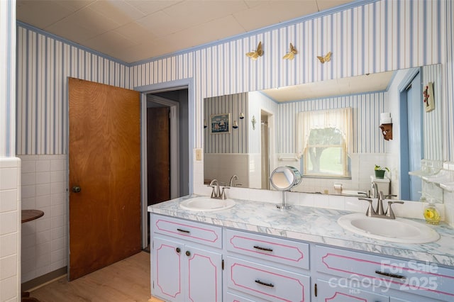 5958 Hoover Elmore Rd, Lincolnton, NC 28092 - bathroom with wallpapered walls, double vanity, wood finished floors, and tile walls