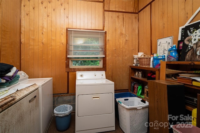 5958 Hoover Elmore Rd, Lincolnton, NC 28092 - laundry area with washing machine and dryer and wood walls
