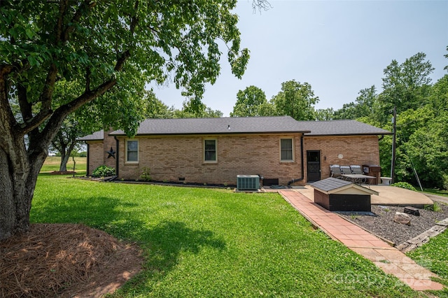 5958 Hoover Elmore Rd, Lincolnton, NC 28092 - rear view of house featuring a lawn, brick siding, central AC, and a patio