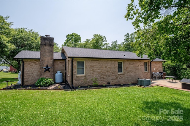 5958 Hoover Elmore Rd, Lincolnton, NC 28092 - rear view of property with a chimney, central air condition unit, a lawn, and a patio